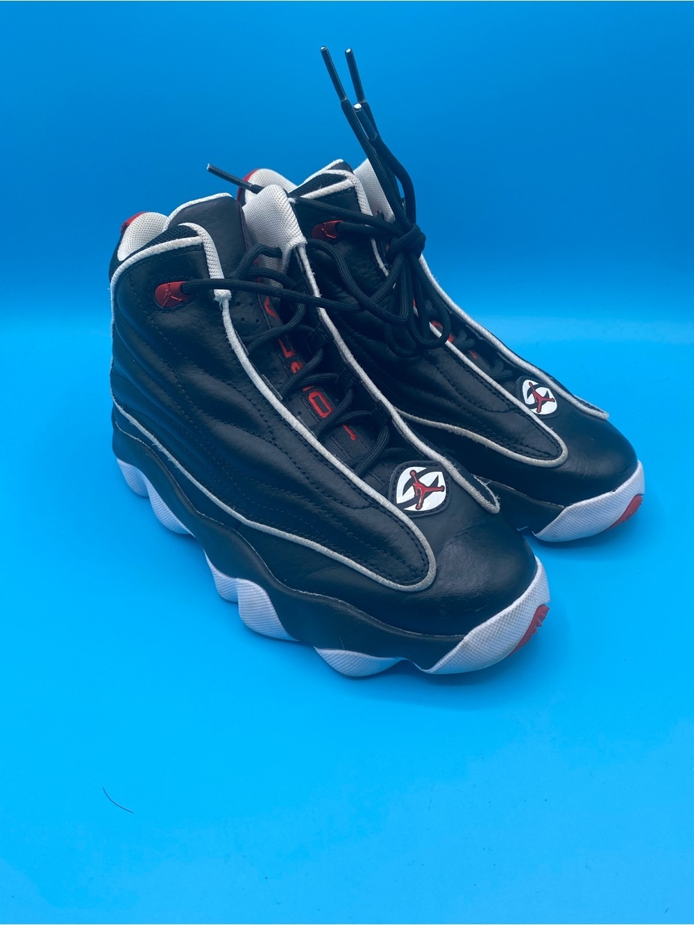 Jordan Pro Strong black, white, and university red